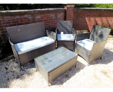 A modern faux rattan cube patio set comprising matching bench seat, two chairs and glass topped table [4] - This lot MUST be 