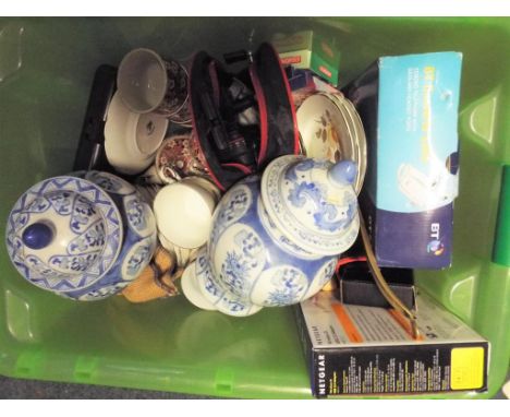 A good mixed lot to include a BT Converse 1200 corded telephone, a Netgear USB stick, a Mullarkey bag containing a Mitchell 3