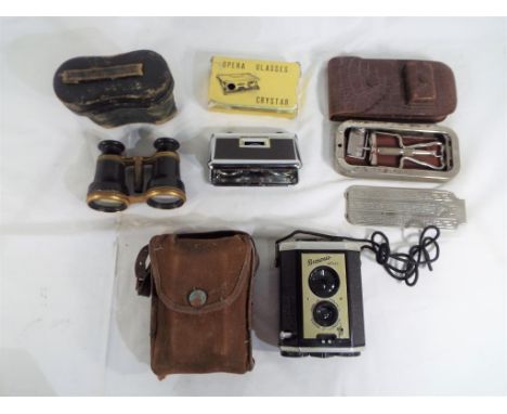 A good lot to include a pair of vintage opera glasses in original case,a set of Crystar opera glasses, a vintage Rolls razor 