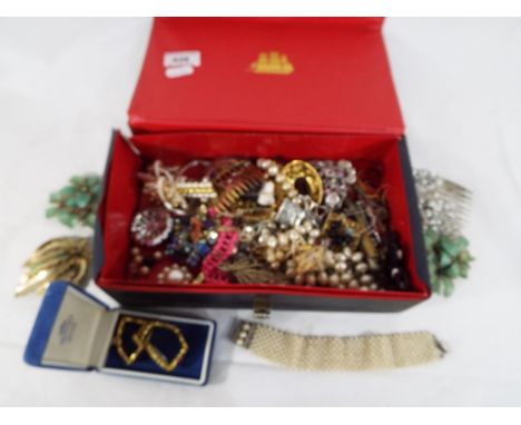 A box containing a quantity of vintage costume jewellery, brooches, bracelets and similar  - This lot MUST be paid for and co