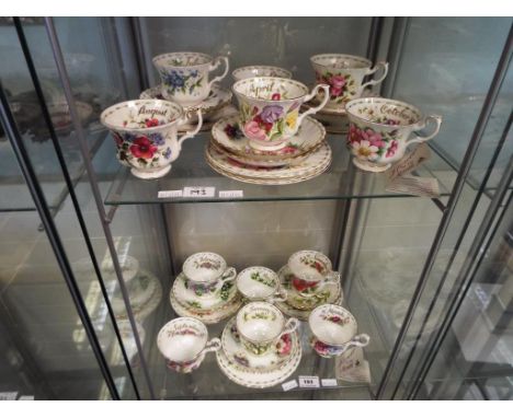 Royal Albert - 35 pieces of Royal Albert Flower of the Month series comprising twelve plates, twelve cups and eleven saucers 