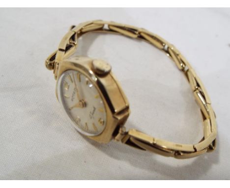 A lady's 9 carat gold cased Rotary wristwatch with yellow metal expanding bracelet stamped .375 (9ct), 15 jewelled movement, 