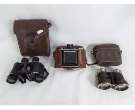 A good mixed lot to include an Olympus camera in original case, a set of binoculars by Wray of London in original case and a 