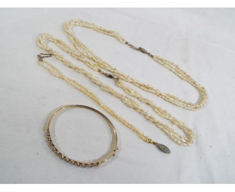 Two triple stranded sea pearl necklaces with a matching double stranded bracelet, also included in the lot is a yellow gold b