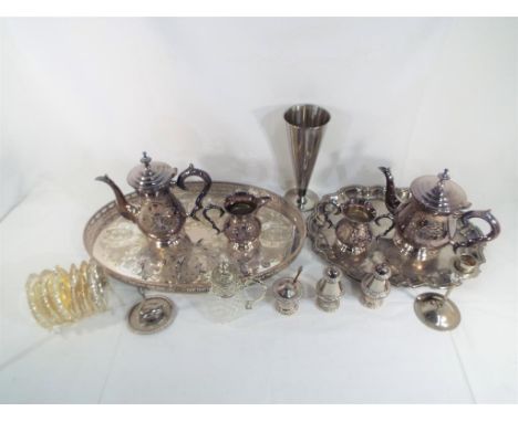 A quantity of silver plated items to include a serving tray, a coffee pot, jug, candlestick, cruets, also included is a moder