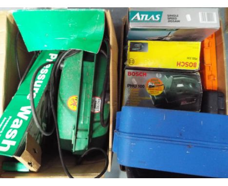 A good lot to include a quantity of tools, comprising a pressure washer, a single speed jigsaw, orbital sander, a planer, soc