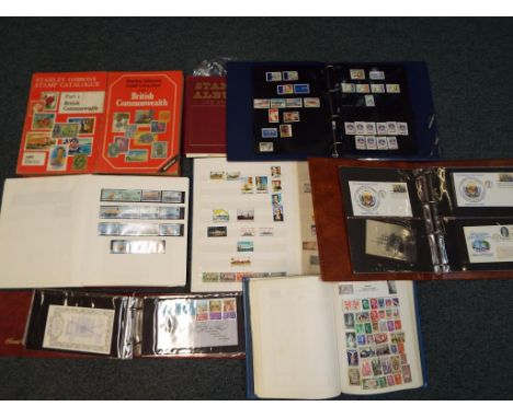 Philately - 2 Stanley Gibbons British Commonwealth stamp catalogues, 5 stamp albums containing a quantity of UK and Worldwide