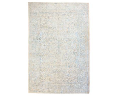 Large cream ground carpet, with overall arabesque design in light blue, within scrolling border Dimensions: Length/Width:&nbs