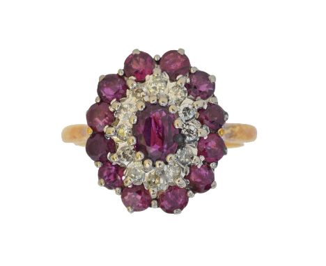A ruby and diamond cluster ring. The oval shape ruby within a single cut diamond and circular shape ruby surround, stamped 18