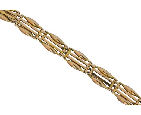 A 9ct gold bracelet by Manton & Mole. The fancy gate link chain with heart shape padlock clasp, maker's marks for Manton &amp