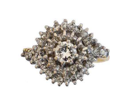 An 18ct gold diamond cluster ring. The brilliant cut diamond weighing approx. 0.30ct within a single cut diamond double surro