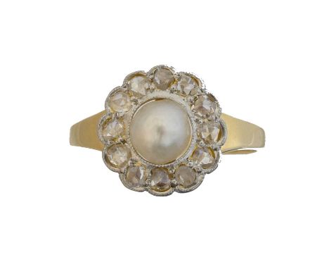 An early 20th century pearl and diamond cluster ring. The slightly off-round pearl within a rose cut diamond scalloped surrou