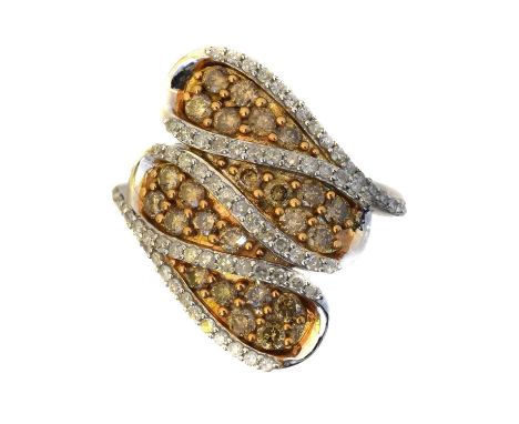 A diamond dress ring. The 'brown' diamond cluster within a brilliant cut diamond surround, estimated total diamond weight 1.1