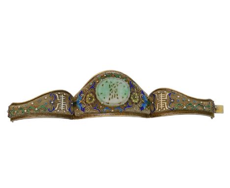 A Chinese jade and enamel silver gilt hinged bangle. The central oval carved jade panel depicting two figures, set atop the s