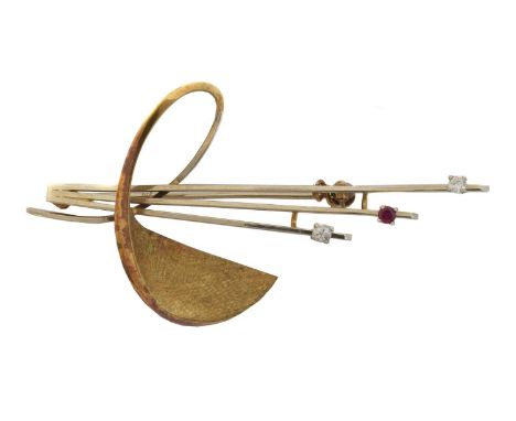 A 14ct gold ruby brooch. Of bi-colour design, set with a circular shape ruby and paste, import marks for London, length 6.3cm