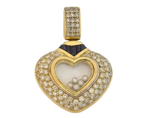 A diamond and sapphire heart pendant. In the style of Chopard, with pave set diamond surround and baguette cut diamond accent