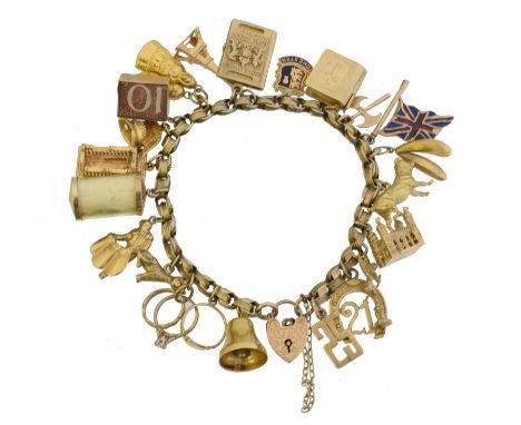 A 9ct gold charm bracelet. The fancy belcher link chain with heart shape padlock clasp, suspending twenty three charms to inc