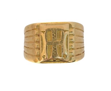 A signet ring. With monogrammed 'TH' or 'HT' detailing and grooved shoulders, ring size Q, gross weight 11.9g.