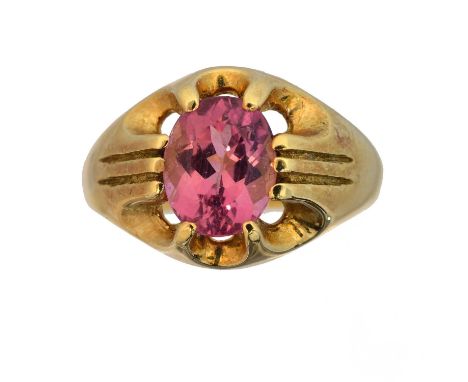 An 18ct gold tourmaline single stone ring. The oval shape pink tourmaline weighing approx. 2.40cts within a ten claw setting,