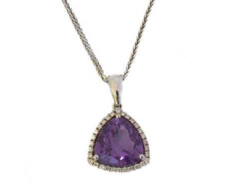 An 18ct gold amethyst and diamond pendant. The triangular shape amethyst weighing 3.05ct within a brilliant cut diamond surro
