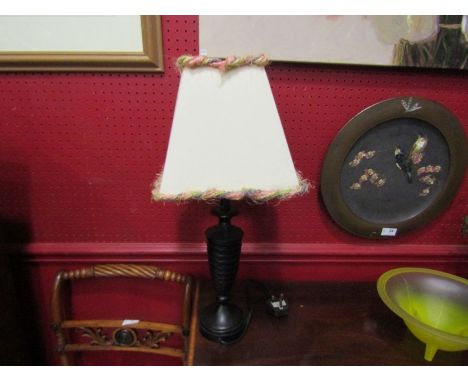 An ebony table lamp with bobbin turned base and cream design shade, 55cm tall 
