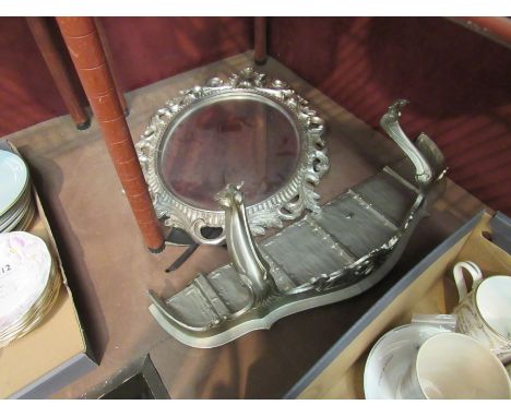 A modern oval easel backed silvered framed mirror, a/f, and composite silver finish wall bracket. Mirror glass, 29.5cm x 22.5