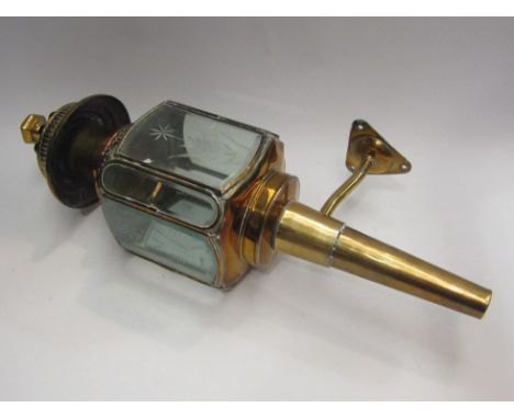 A brass wall mounting coaching lamp 