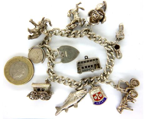 925 silver charm bracelet with eleven charms, L: 20 cm, 52g. P&amp;P Group 1 (£14+VAT for the first lot and £1+VAT for subseq