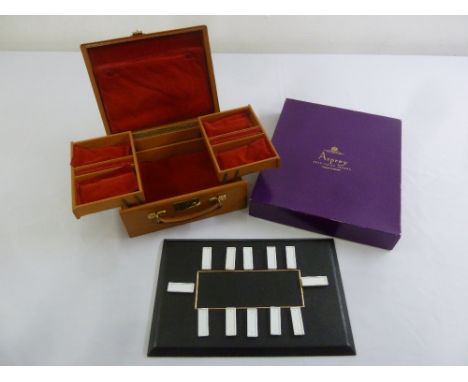 An Asprey rectangular table plan in original packaging and a leather travelling jewellery box