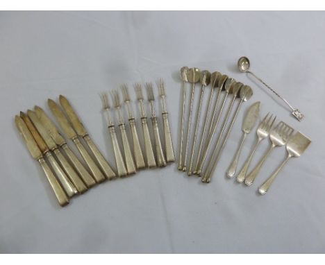 A quantity of silver and white metal flatware to include dessert eaters and mate straws