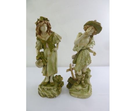 A pair of Czech ceramic figurines of a girl and a boy, A/F