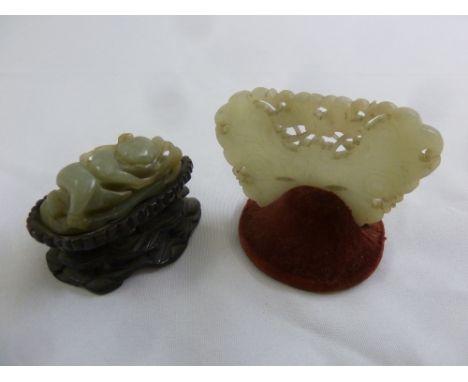 Two Chinese jade carvings, one of a butterfly the other of a recumbent figure
