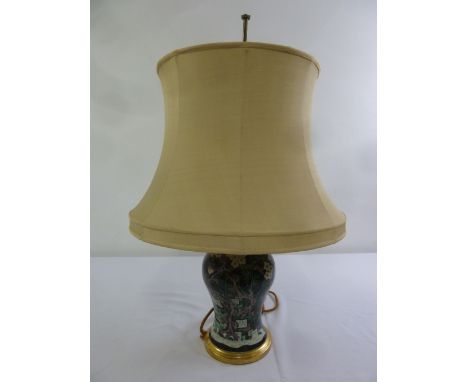 An 19th century baluster form ceramic lamp base with shade