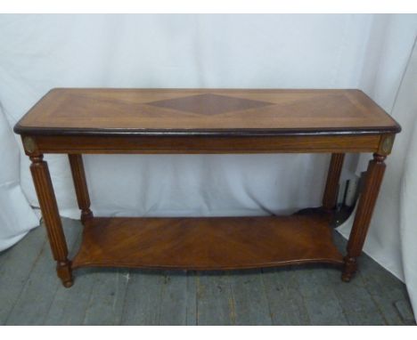 A rectangular mahogany inlaid side table with lower shelf and four fluted cylindrical legs