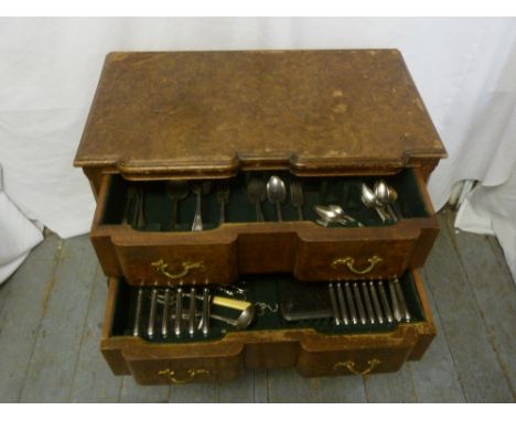 A mahogany Queen Anne style canteen with two drawers on ball and claw feet to include silver plated flatware