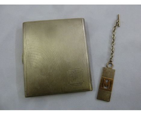 A silver engine turned cigarette case and a silver key ring