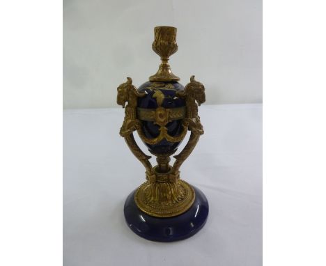 A French blue ceramic candle holder with ormolu mounts on raised circular base