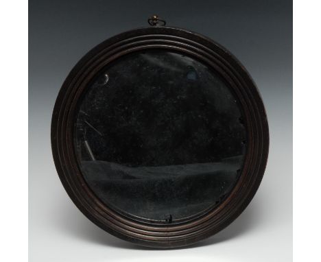 A 19th century convex looking glass, the mirror plate within a reeded border, 25cm diam 