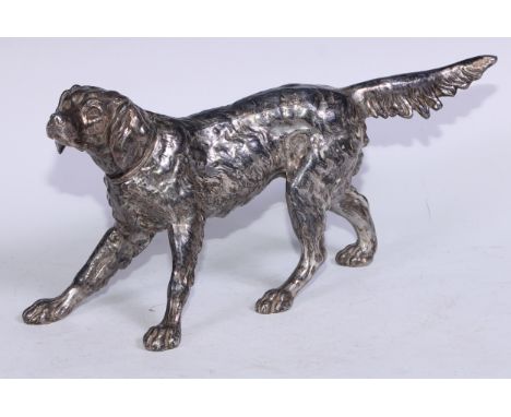 A large Art Deco period table cigarette lighter, in the manner of WMF as a retriever dog, the head a hinged cover, 35cm long,