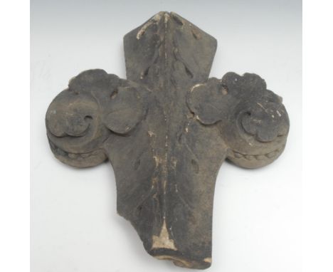 A Gothic Revival limestone architectural fragment, carved as a trefoil poppy head finial, 33cm long, 19th century 
