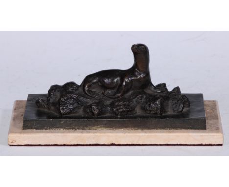P Panichelli (early 20th century), a dark patinated bronze, of a Sea Lion, rectangular marble base, 20.5cm wide 