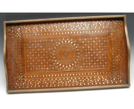 An Indian hardwood and marquetry gallery tray, profusely inlaid in copper and brass with leafy stems, lozenges and intersecti