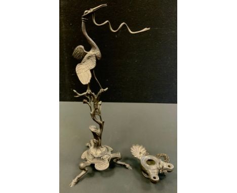 A 19th century Grand Tour bronze lamp,&nbsp; of a stork holding a snake, oil lamp suspended from the coil snake, tripod base,