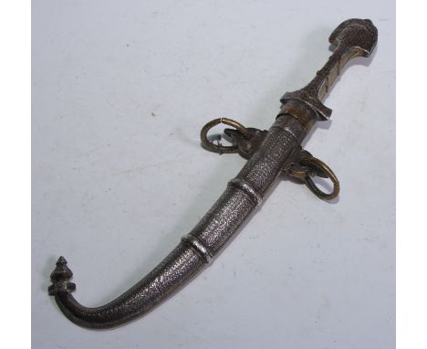 A North African/Middle Eastern silver mounted koummya or kindjal dagger, 23cm curved blade, the hilt and scabbard chased with