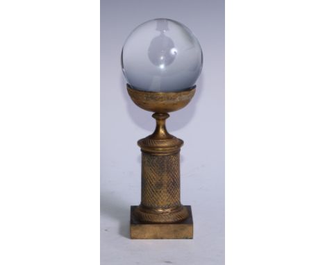 Mysticism and the Occult - a crystal ball, the gilt bronze Empire stand mid-19th century, 26cm high 