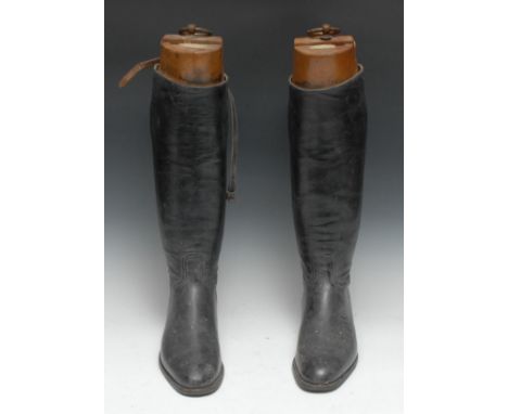 The Country House Interior - a pair of early 20th century black leather riding boots, the beech trees with labels for Arthur 