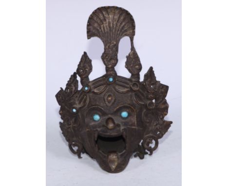 A Tibetan bronze demon-head censor, set with turquoise jewels and eyes,  19cm high 