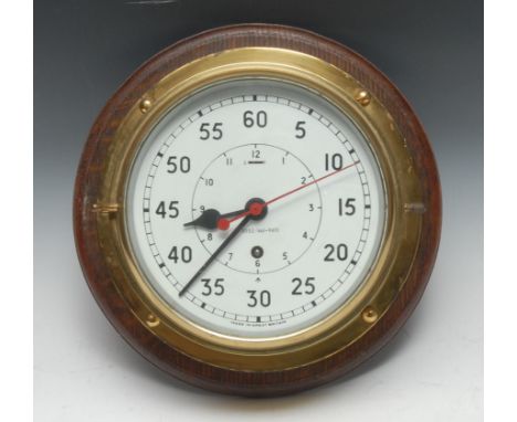 A military lacquered brass bulkhead marine timepiece, the 18.5cm clock dial with broad arrow mark and numbered 0552/461-9413,