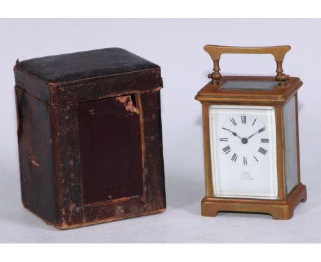 A lacquered brass carriage clock, Cowell, Douglas I of Man, leather carry case with key 