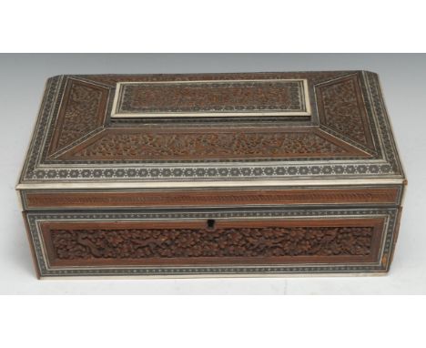 An Indian sandalwood and sadeli marquetry sarcophagus work box, hinged cover enclosing a lift-out tray with an arrangement of